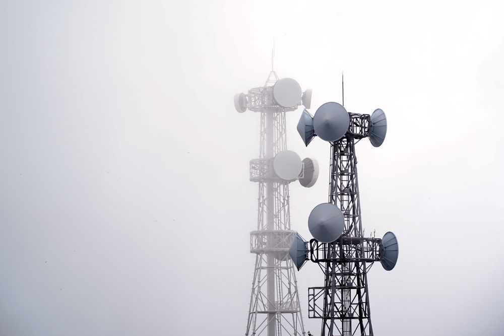 Two broadcast towers in gray sky